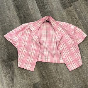 Pink Brandy Melville button-up shirt.